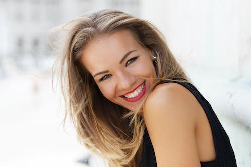 woman smiling with full set of white teeth in golden coast