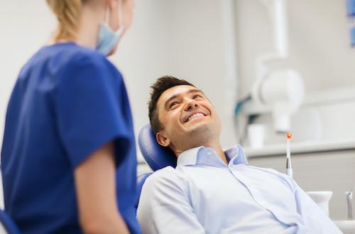 A patient smiling at their dentist