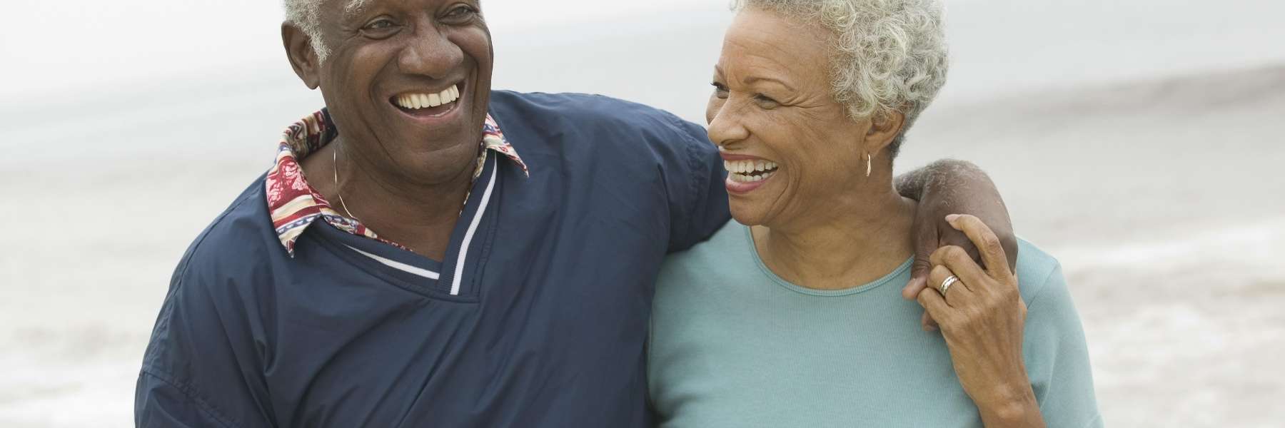 A couple joyfully smiling at each other