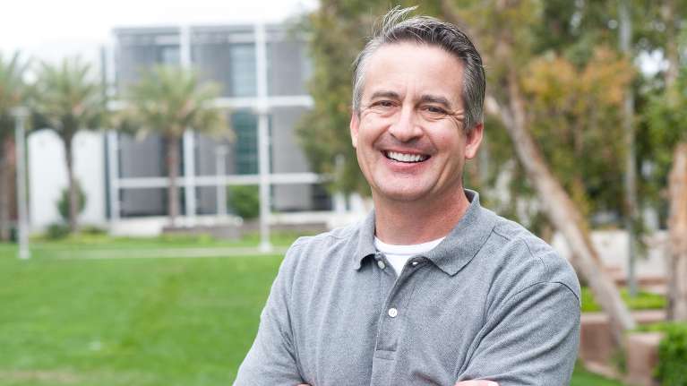 A smiling man outside | laser dentistry long beach