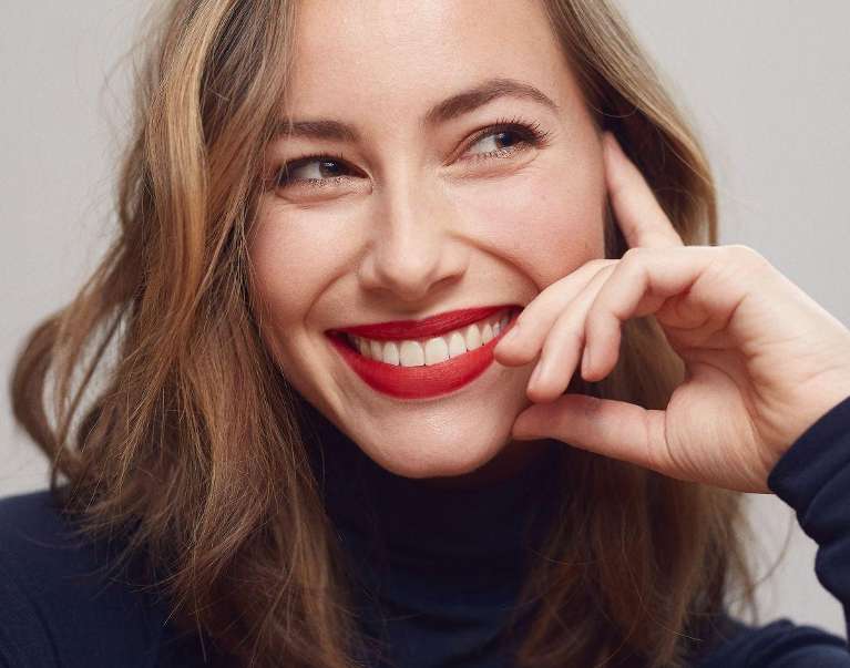 A smiling woman with whitened teeth