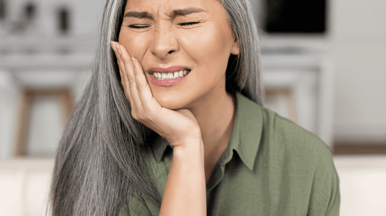 A woman having a dental emergency in Long Beach