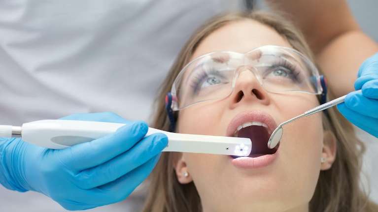 A woman getting dental implants in Long Beach