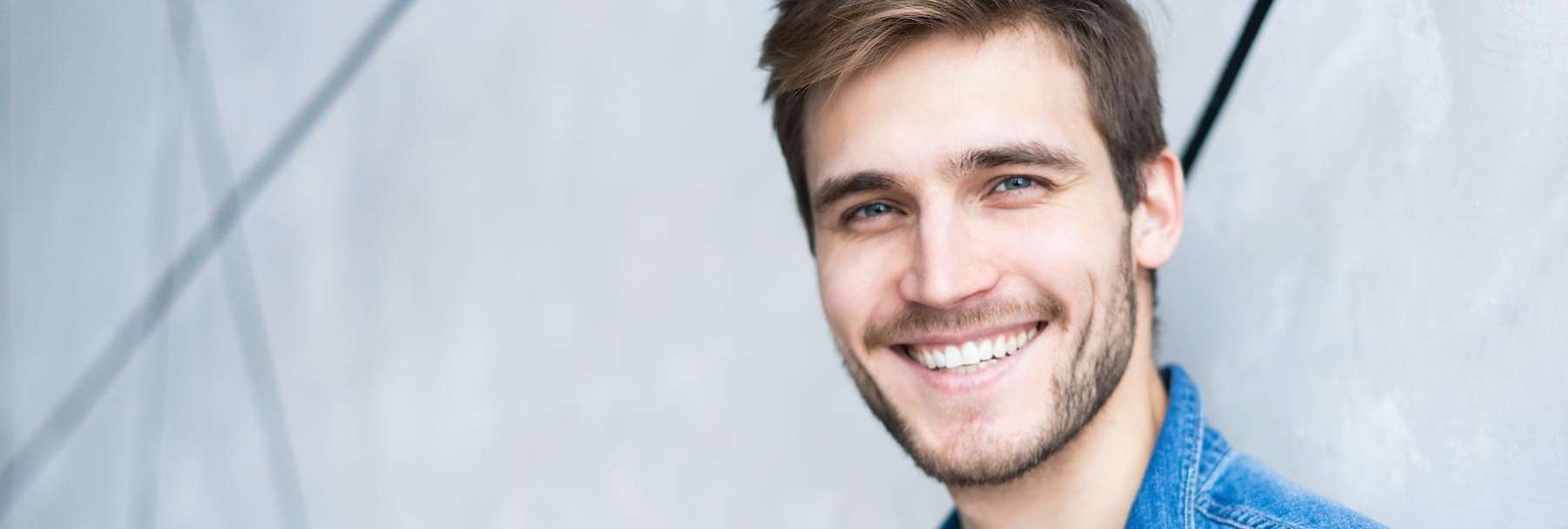 man smiling near golden coast dental clinic