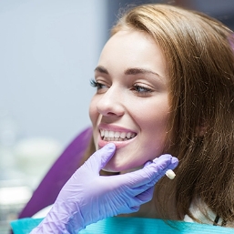 Golden Coast Dental Care dentist checking on patients teeth