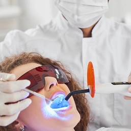 Golden Coast Dental Care image of dentist using laser dentistry